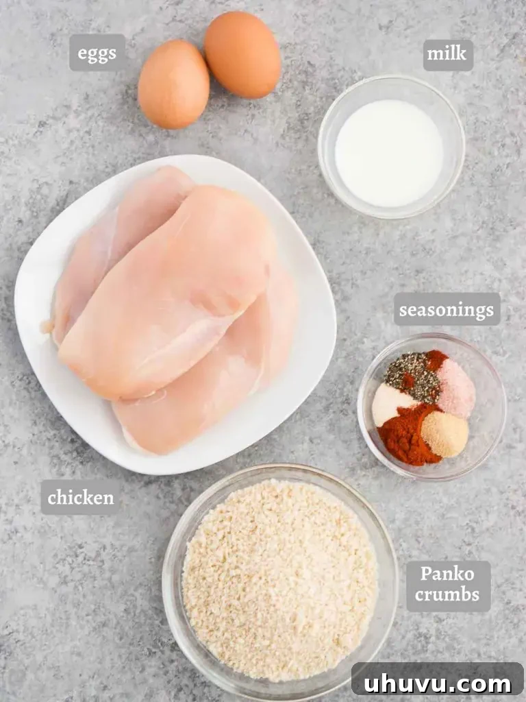 ingredients for chicken nuggets laid out on a table