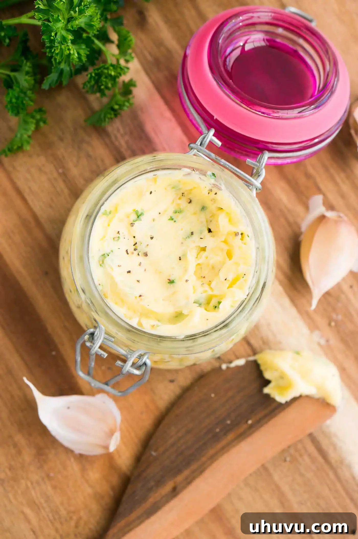 Garlic Gold 6 An elegant jar filled with homemade garlic and herb butter, ready for use.