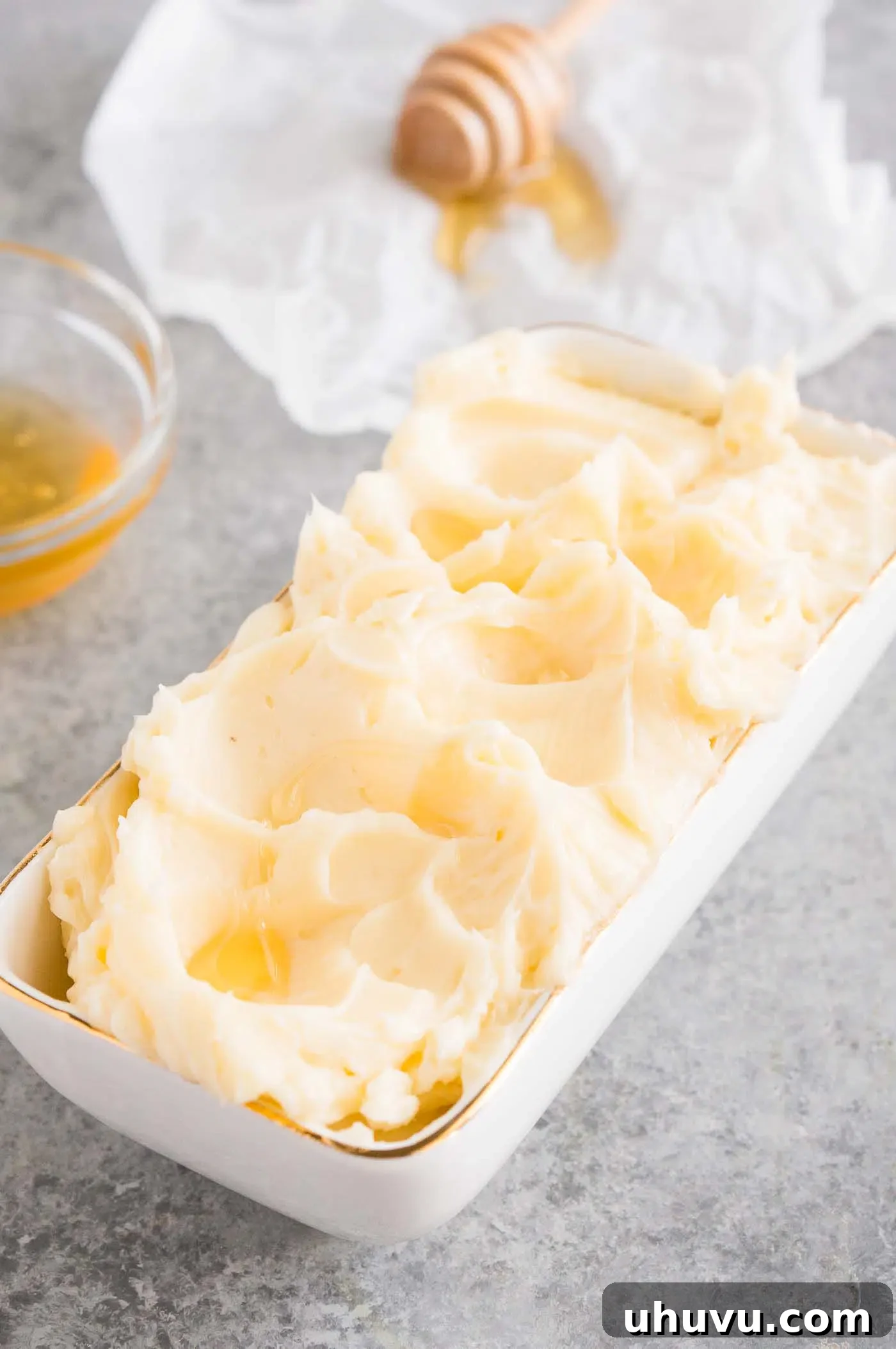 Close up image of fluffy whipped honey butter in a bowl, ready to be served