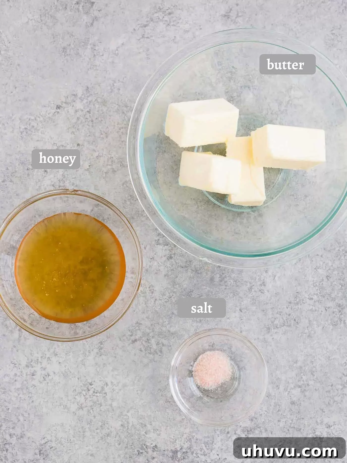 Ingredients laid out for making honey butter: butter, honey, and a pinch of sea salt