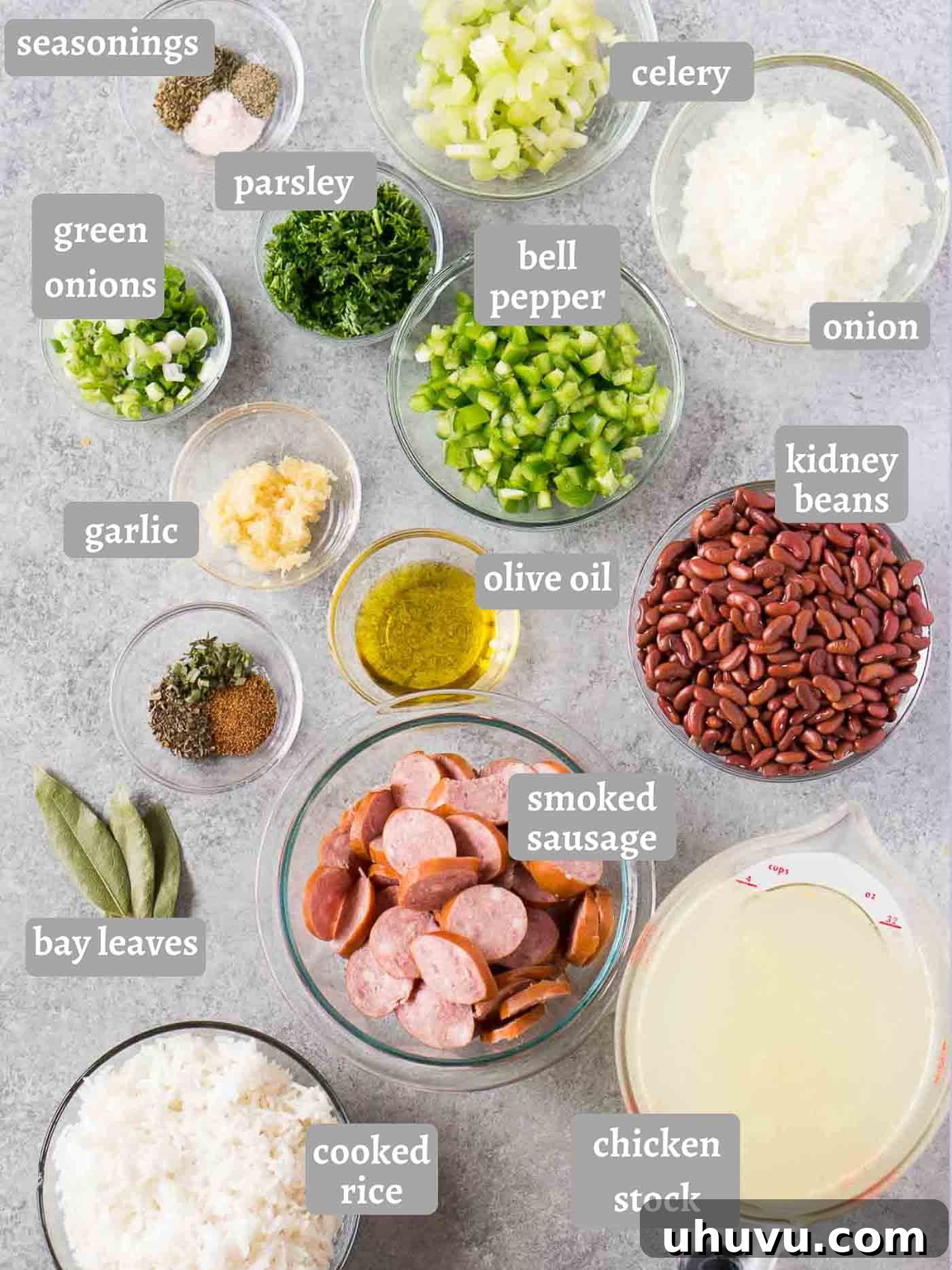 Southern Comfort Instant Pot Red Beans and Rice 4 Assortment of fresh ingredients laid out for Instant Pot Red Beans and Rice, including sausage, vegetables, and dried beans.