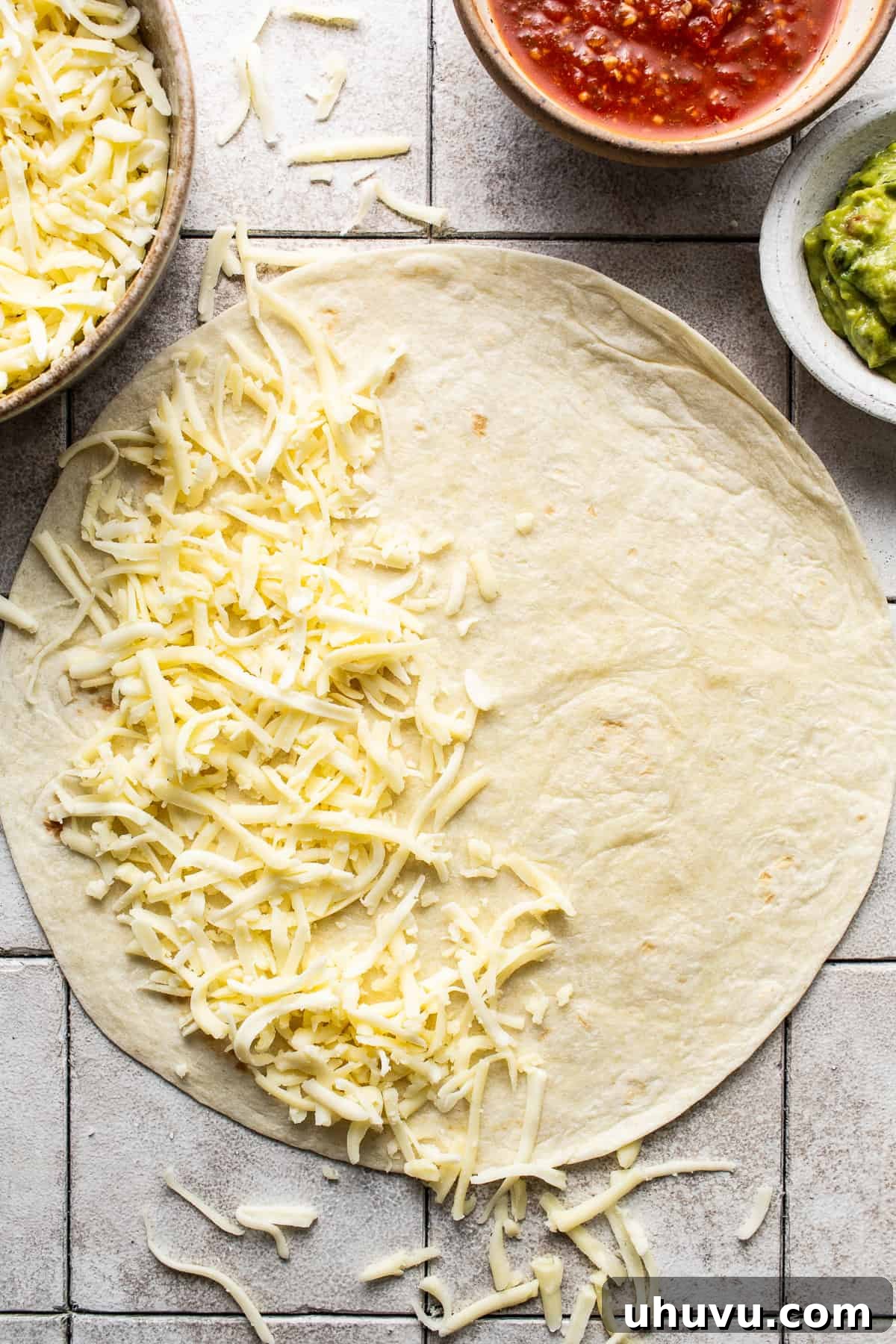 Irresistible Cheesy Quesadilla 4 Shredded cheese on one half of a large flour tortilla to make quesadillas.