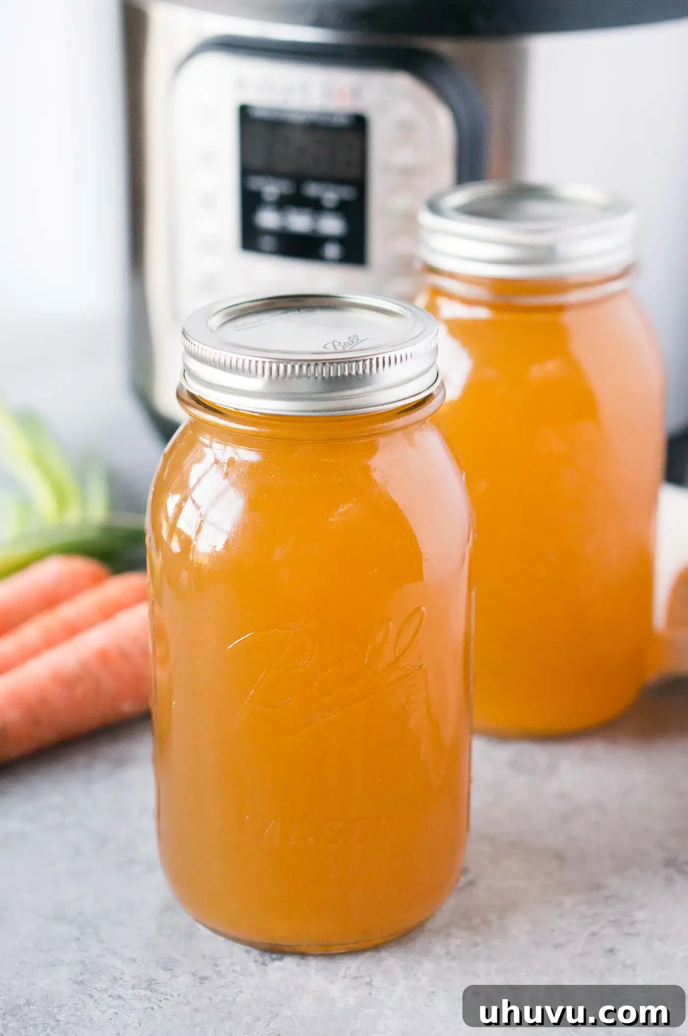 Homemade Turkey Stock 8 Multiple glass jars filled with homemade Instant Pot turkey stock, ready for storage or use