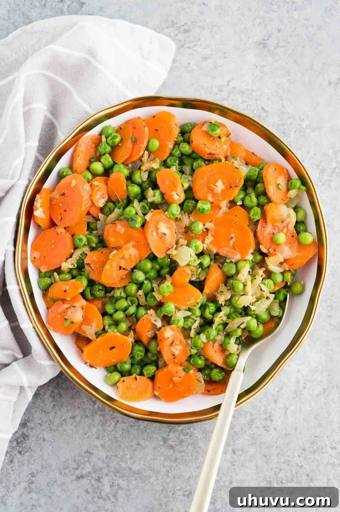 carrots and peas serving on a plate
