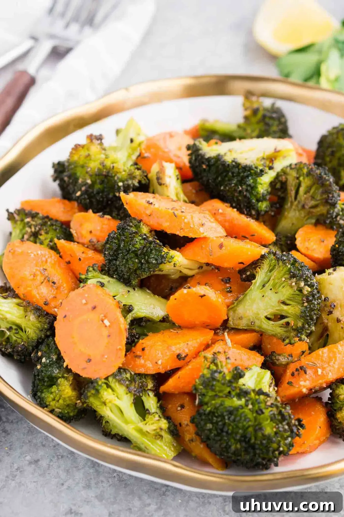 easy and quick roasted carrots and broccoli in a white bowl
