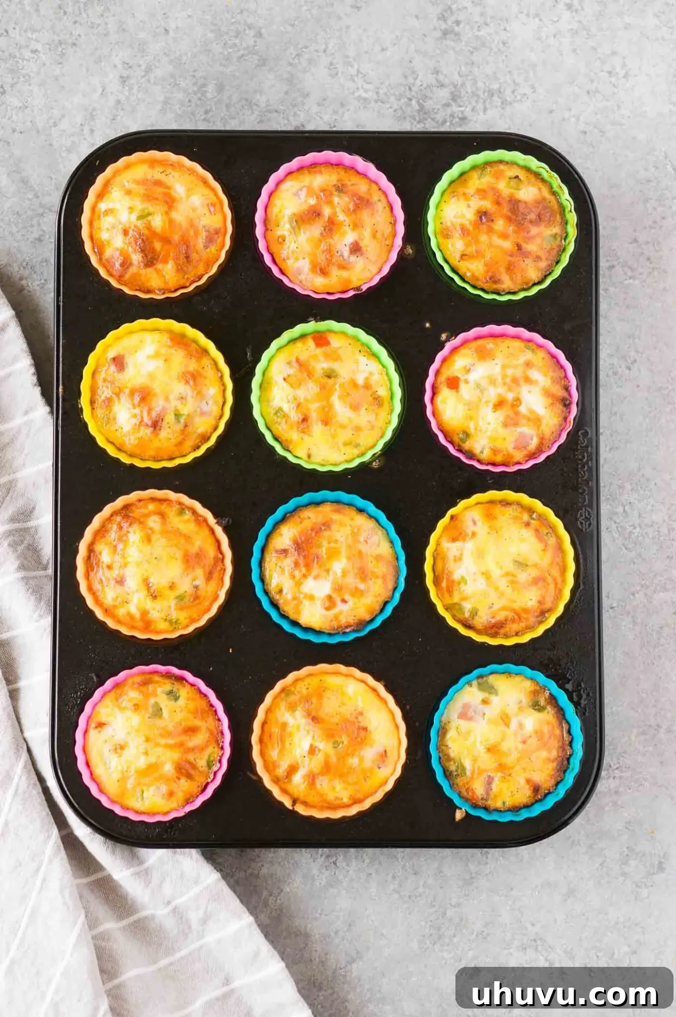 Freshly baked egg muffins cooling in silicone cups