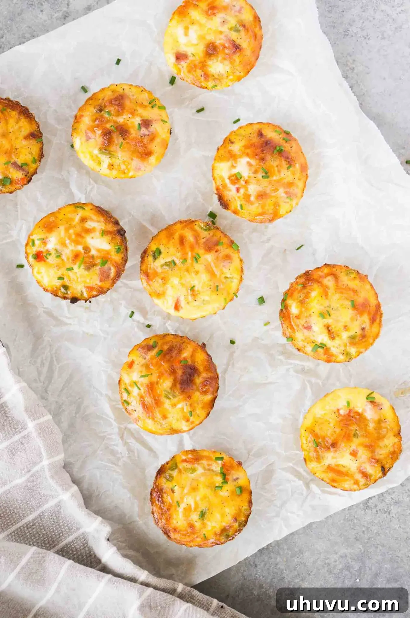 Individual egg cups arranged on parchment paper, ready for storage or serving