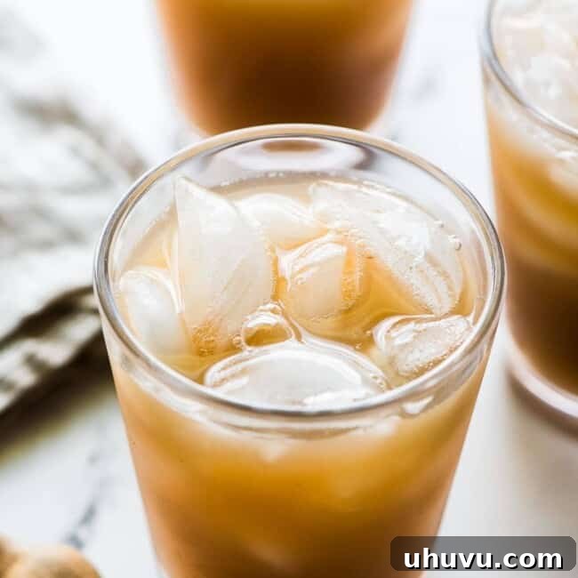 Agua de Tamarindo drink in a glass with ice.