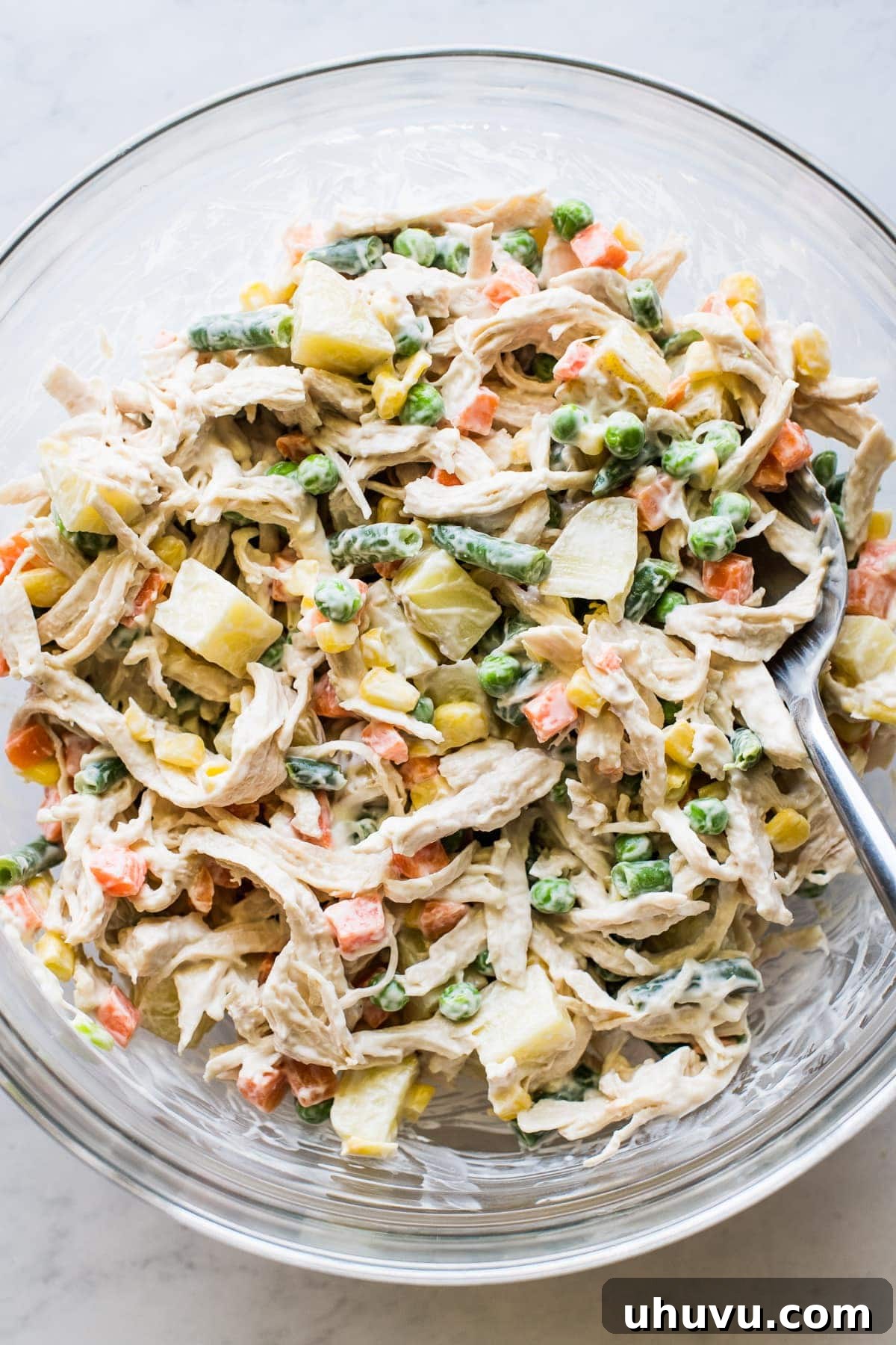 Classic Chicken Salad 2 A large mixing bowl filled with creamy Ensalada de Pollo, ready to be served.