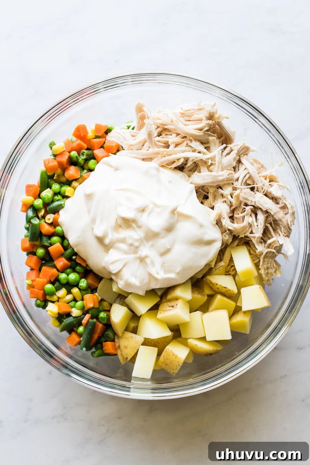 Classic Chicken Salad 4 All the Ensalada de Pollo ingredients combined in a large bowl, ready for mixing and chilling.