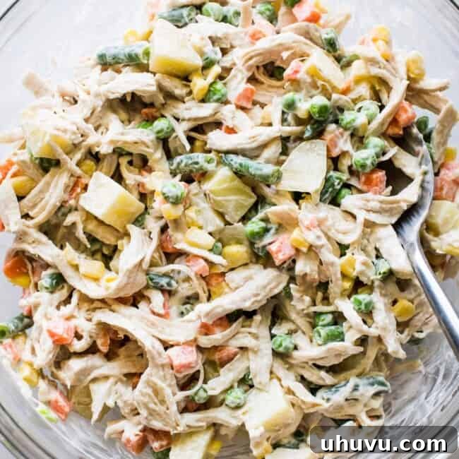 Classic Chicken Salad 6 Ensalada de pollo in a mixing bowl.