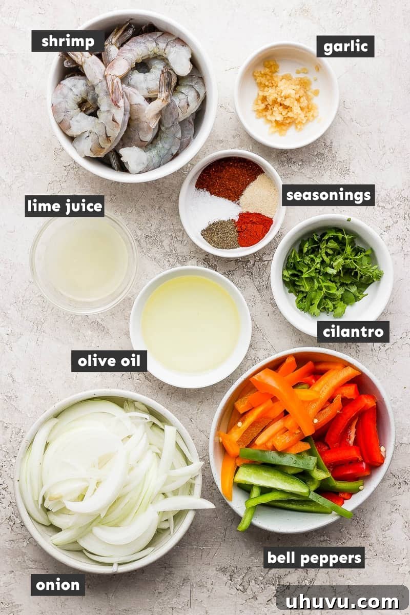 Vibrant Lime Shrimp Fajitas 3 A selection of fresh ingredients laid out for making shrimp fajitas, including bell peppers, onions, lime, cilantro, and spices.