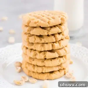 stacked soft peanut butter cookies on a plate