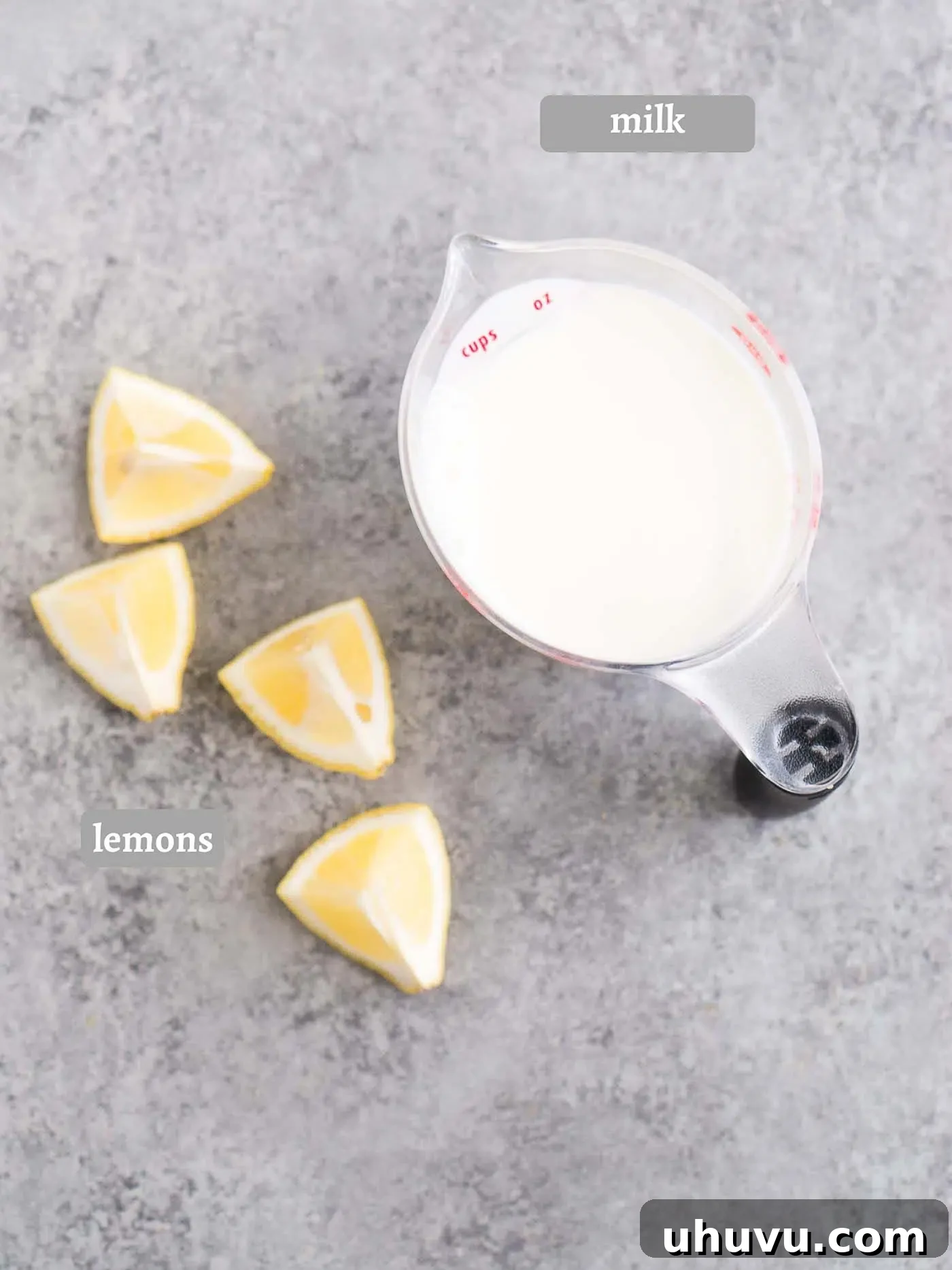 Two ingredients, milk and lemon, for making homemade buttermilk