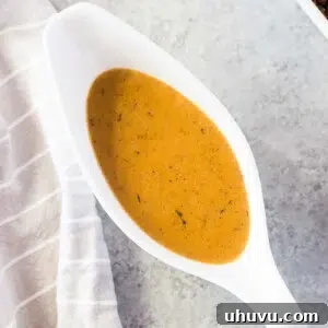 close up image of homemade gravy in a gravy boat, a perfect accompaniment