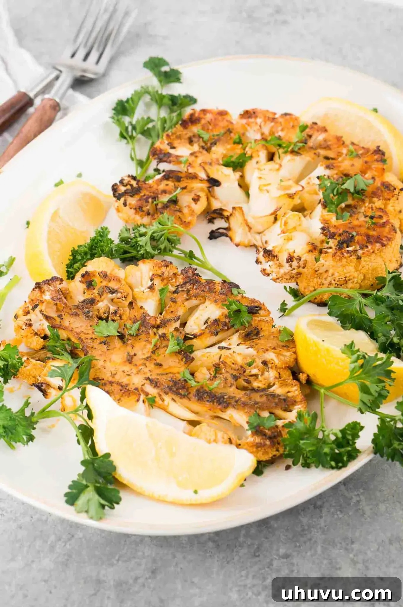 seasoned roasted cauliflower steaks on a plate
