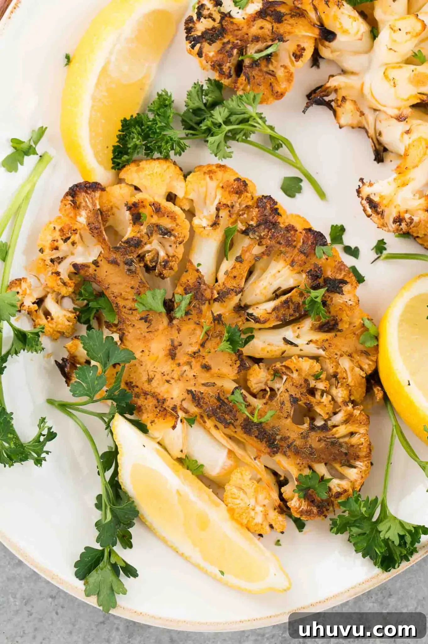 close up image of cauliflower steak on a platter