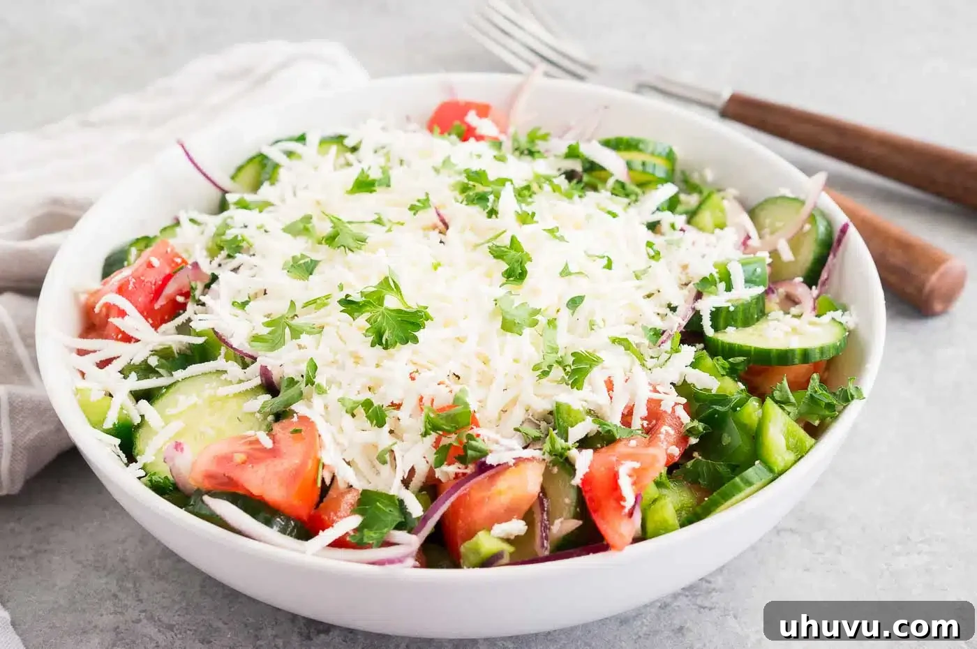 Authentic Bulgarian Shopska Salad 4 shopska salad in a white bowl, ready to be served