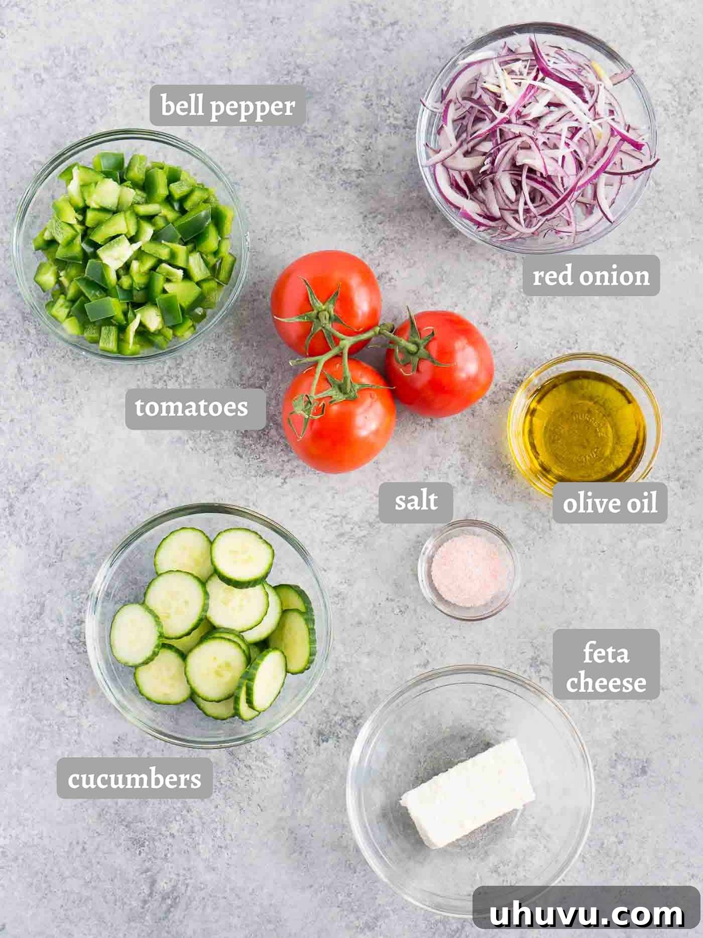 Authentic Bulgarian Shopska Salad 5 shopska salad ingredients, fresh tomatoes, cucumbers, bell pepper, onion, olive oil, and feta cheese