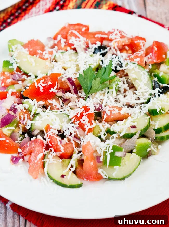 Authentic Bulgarian Shopska Salad 7 shopska salad garnished with a fresh parsley leaf, inviting presentation