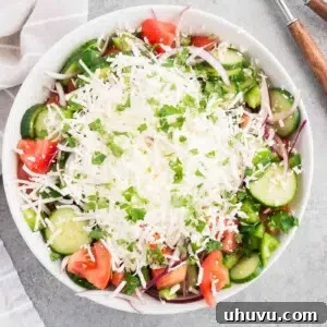 shopska salad - bulgarian salad with feta cheese in a bowl