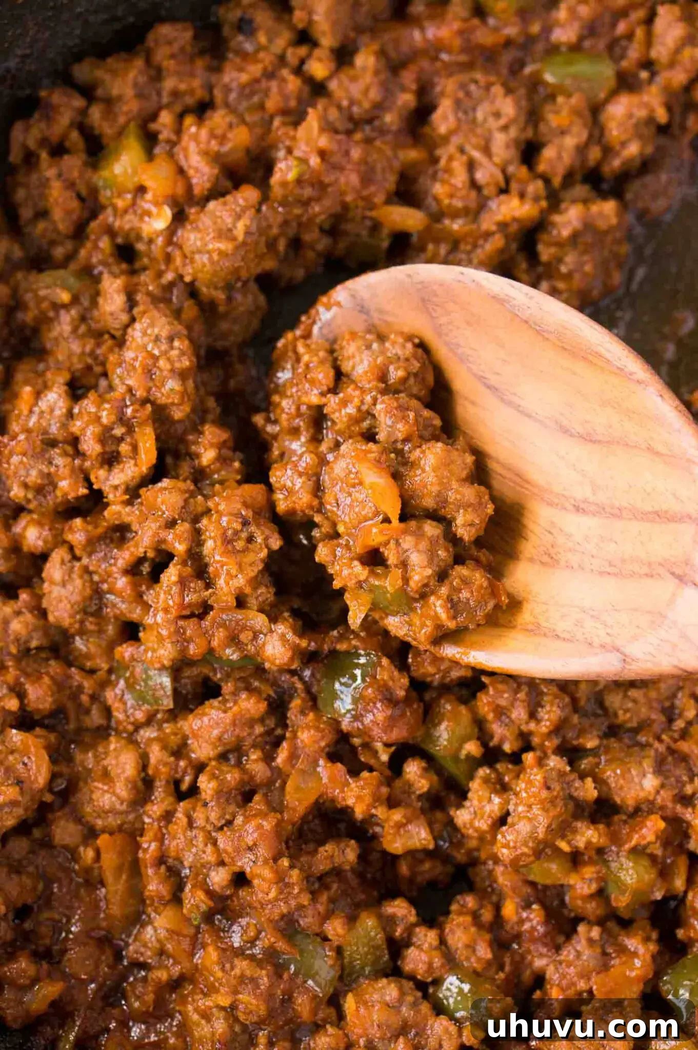 Close up image of the rich, saucy sloppy joes meat mixture simmering in a skillet, ready to be served