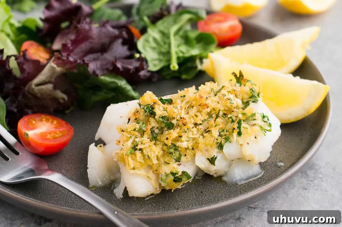 close up image of cod with topping on a plate