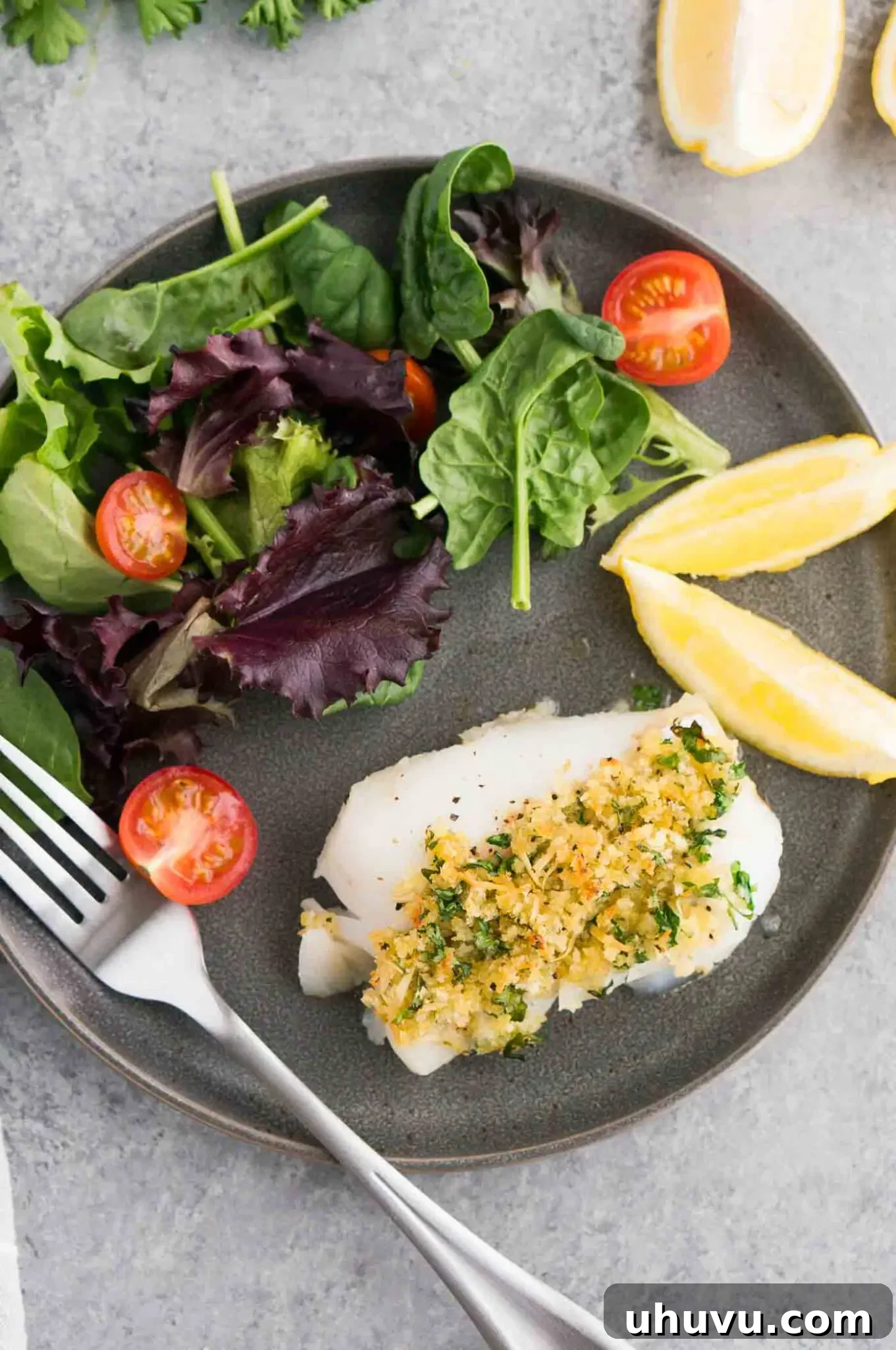 white fish with salad on a plate