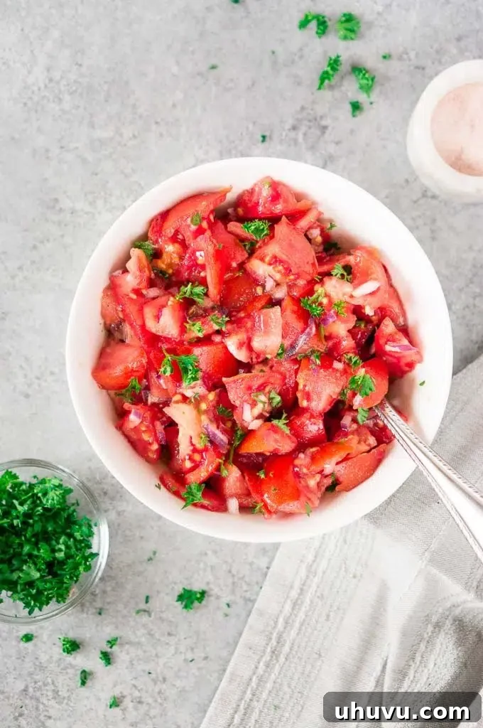 Close-up of fresh tomato and red onion slices prepared for a salad