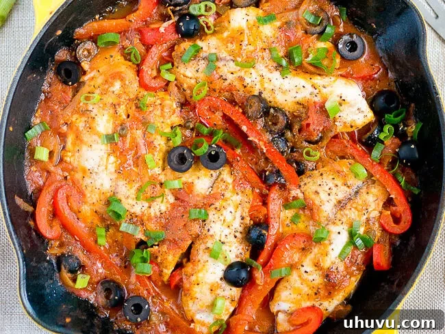 Cooked Tilapia Veracruz in a skillet, ready to serve