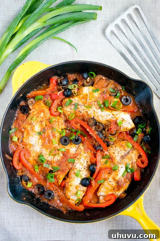 A vibrant plate of One-Skillet Tilapia Veracruz with rice
