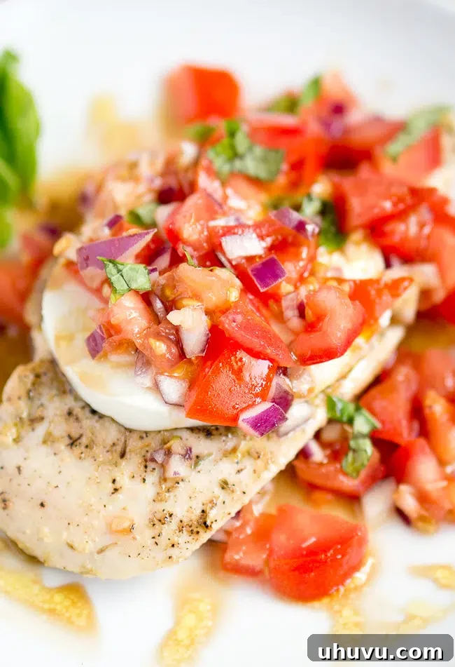 Ingredients for Grilled Chicken Caprese, including fresh tomatoes, mozzarella, and basil