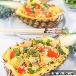 halved pineapple filled with pineapple fried rice