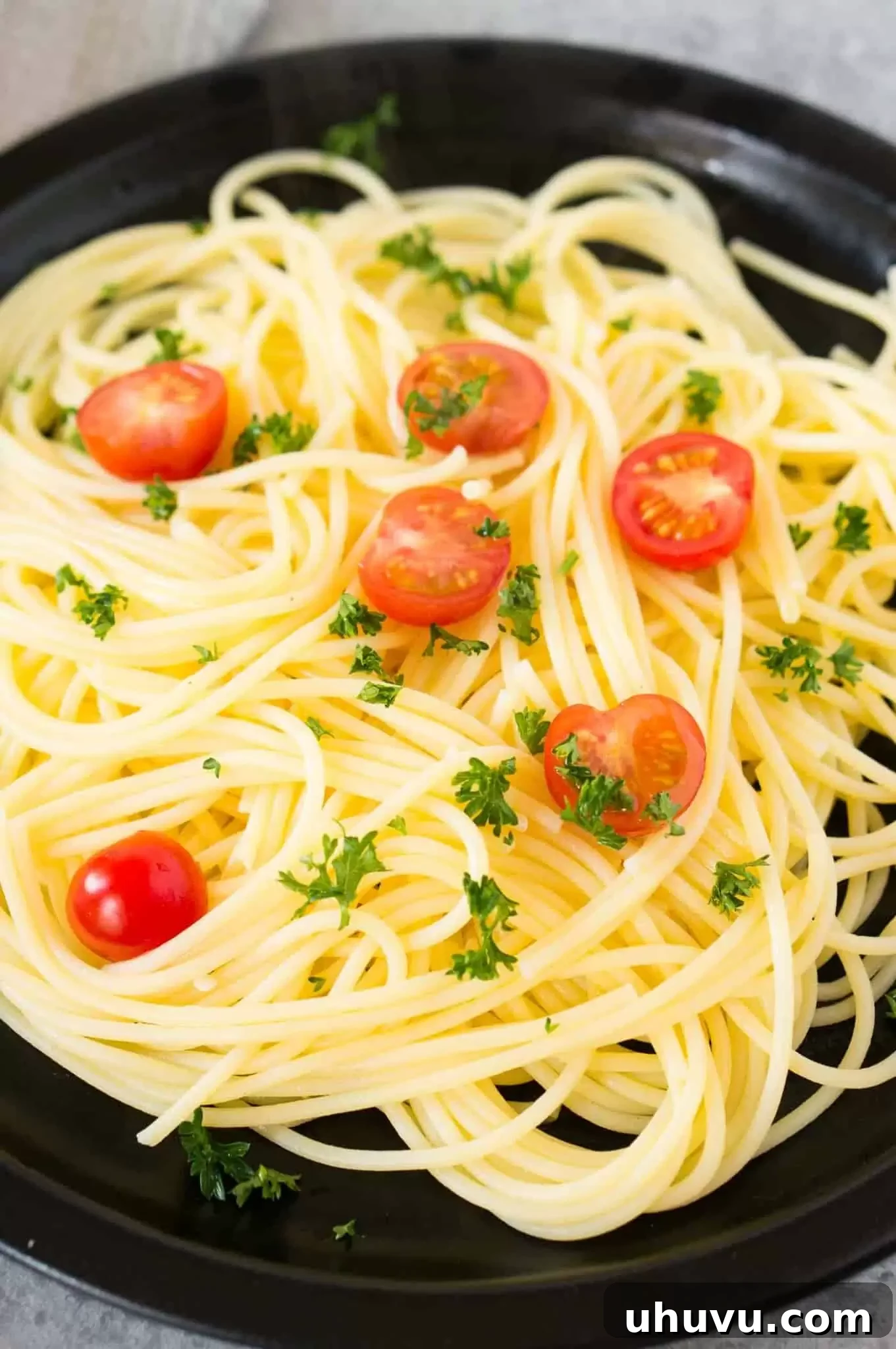 Unlock the Secrets to Perfect Pasta 9 A bowl of perfectly cooked spaghetti, beautifully presented with a garnish, highlighting its ideal texture.