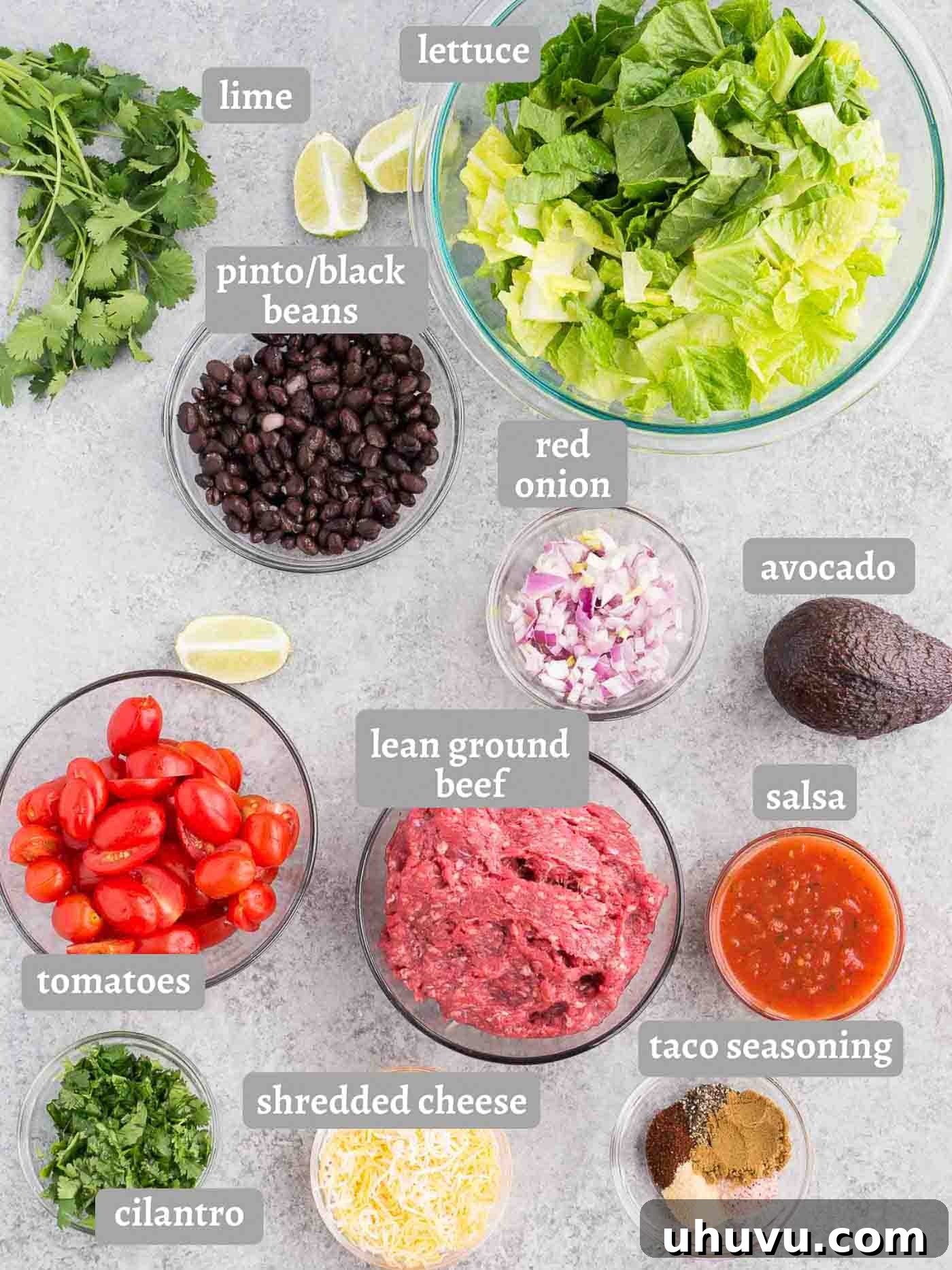 Ingredients for taco salad laid out on a table