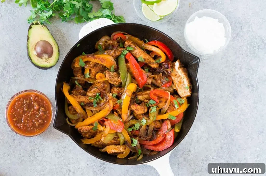 chicken fajitas in a skillet from above