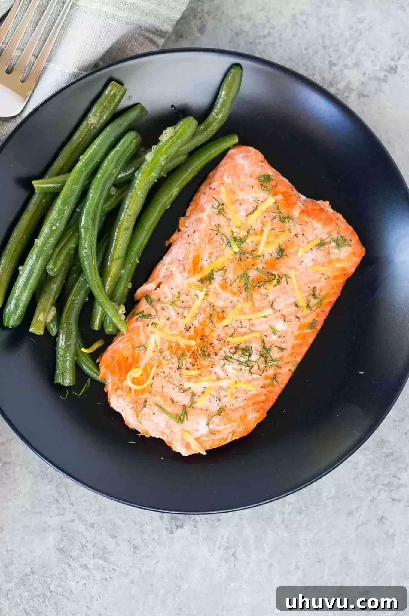 Close-up of a beautifully cooked sous vide salmon fillet, highlighting its flaky texture and golden-brown sear.