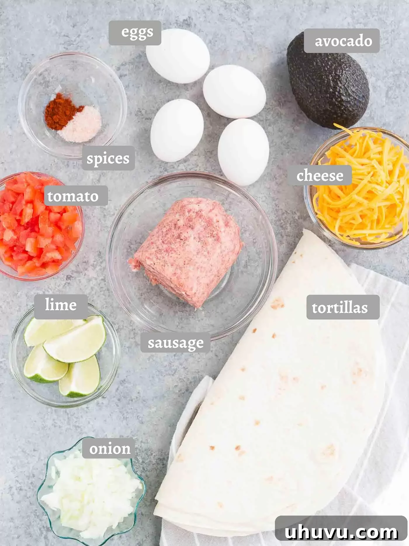 A vibrant assortment of fresh ingredients laid out for making breakfast burritos