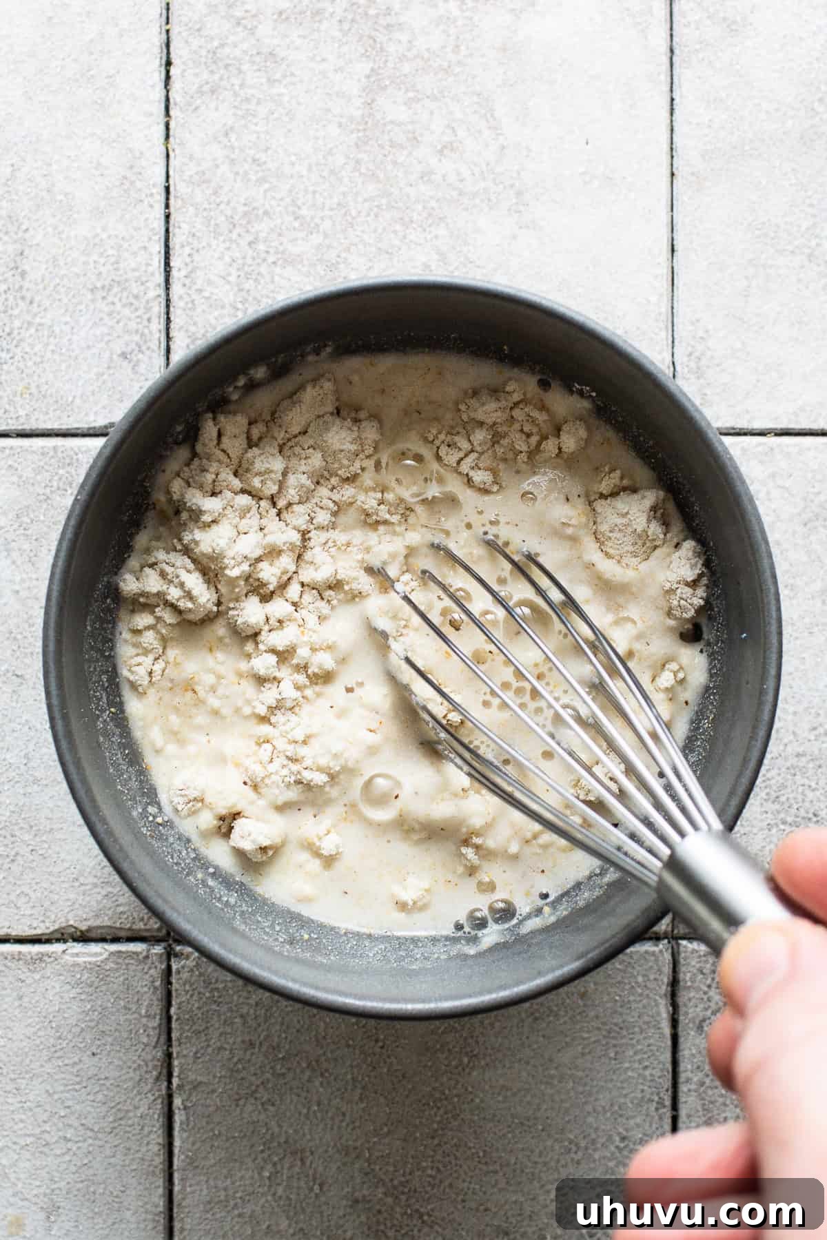 Velvet Corn Chocolate 5 Masa harina and water being whisked in a bowl.