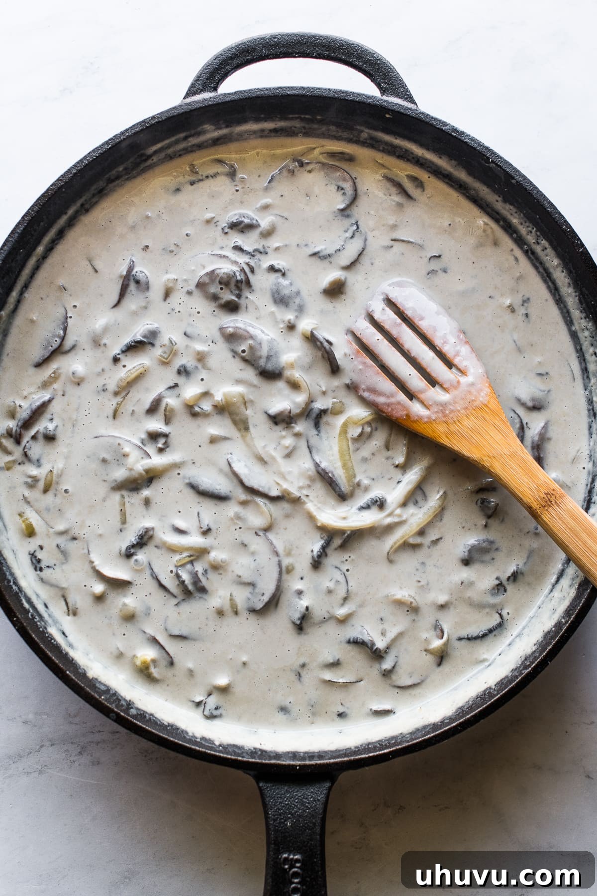 Ultimate Fresh Green Bean Bake 4 The rich, creamy gravy sauce for homemade green bean casserole, simmering to perfection.