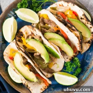 Instant Pot Steak Fajitas on a plate with fixings