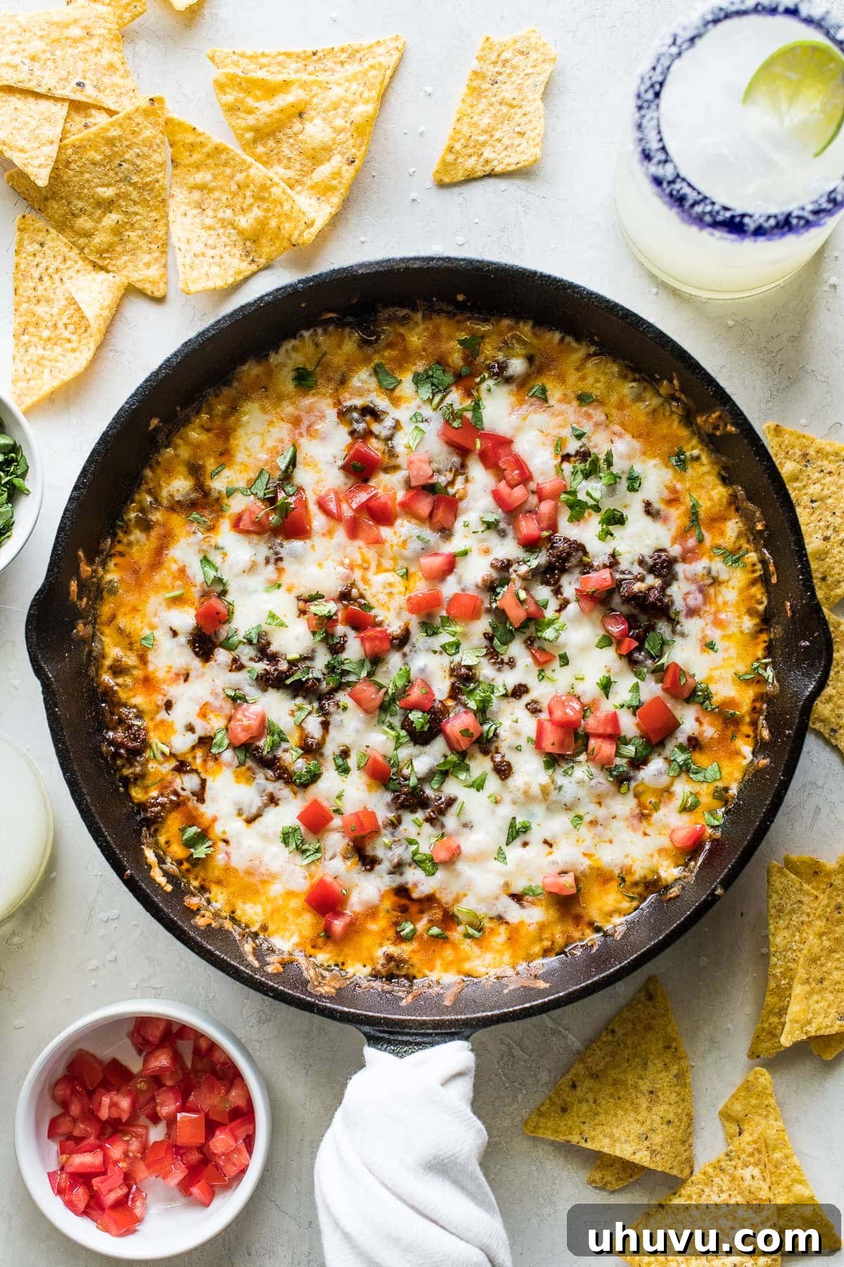 Ultimate Cheese Dip 2 Queso fundido in a skillet with crumbled chorizo.