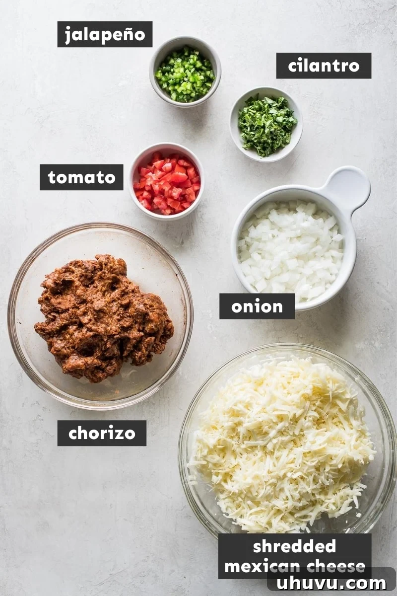 Ultimate Cheese Dip 3 Ingredients for Queso Fundido including cheese, chorizo, onion, and jalapeños.