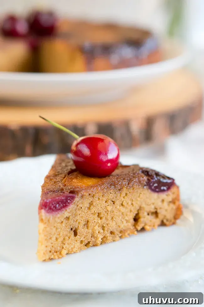 Delicious and moist Peach Cherry Upside Down Cake with almond flavor, perfect for any occasion.