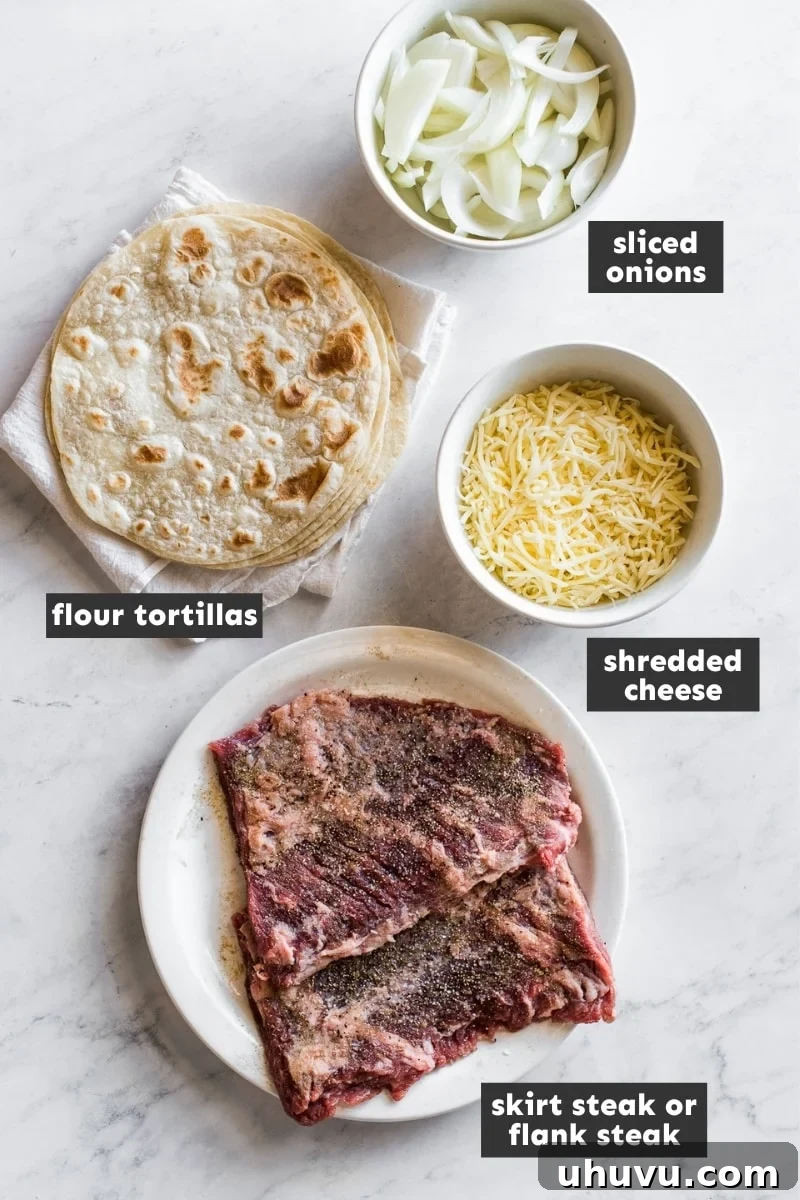 Gourmet Steak Quesadillas 3 Ingredients for steak quesadillas laid out on a cutting board, including steak, onions, cheese, and tortillas.
