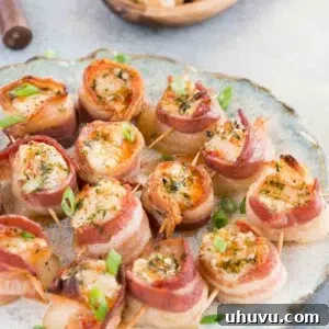 Smoky Bacon-Wrapped Scallop Bites 8 A close-up of a finished plate of bacon wrapped scallops, highlighting their delicious appearance.
