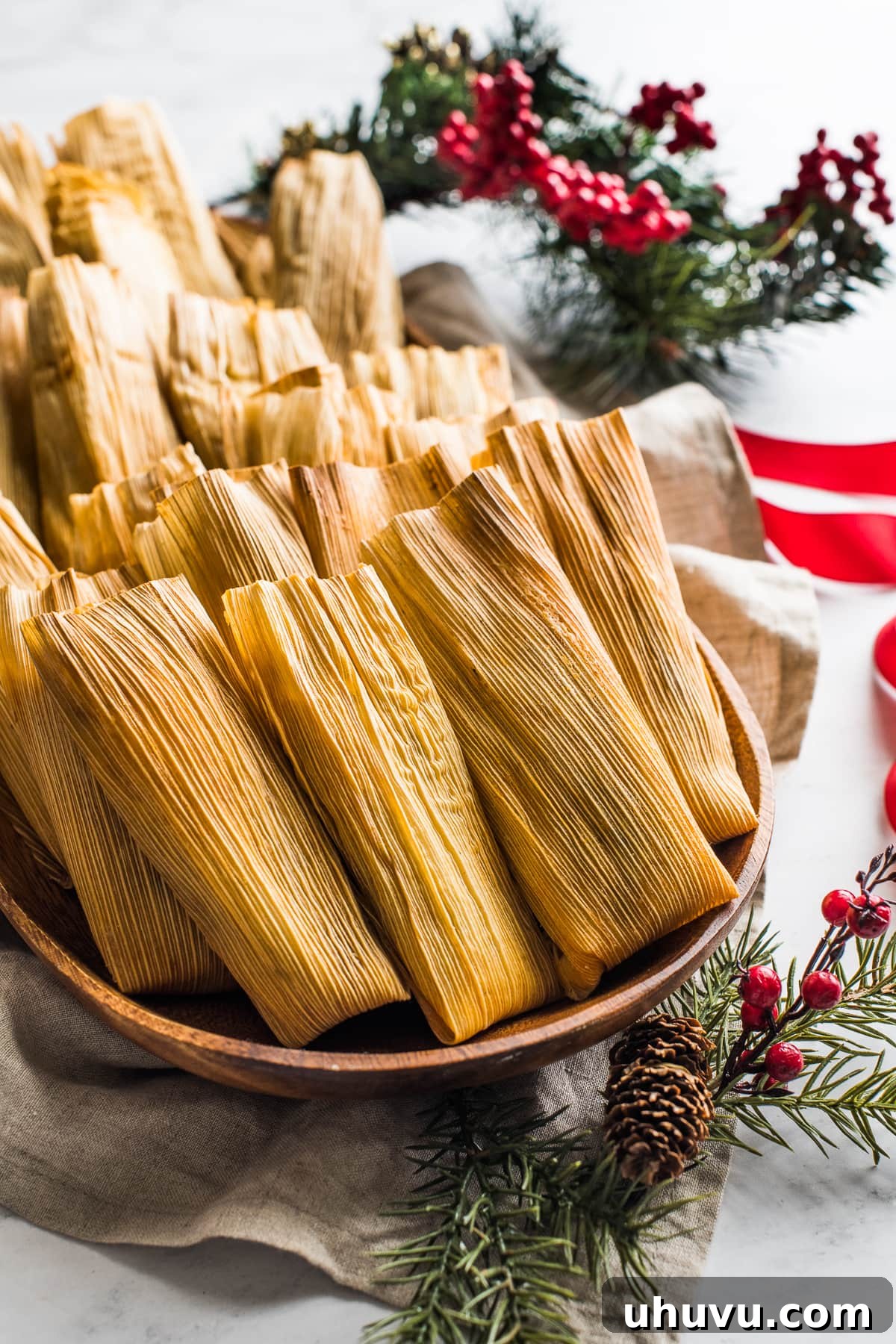 Instant Pot Tamales arranged on a festive serving platter.