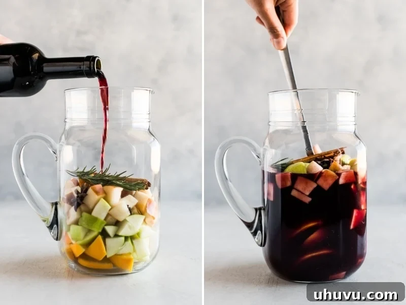 Fireside Sangria 4 Winter sangria in a pitcher being mixed together.