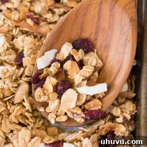 Baked granola on a baking sheet, ready to be served or stored.