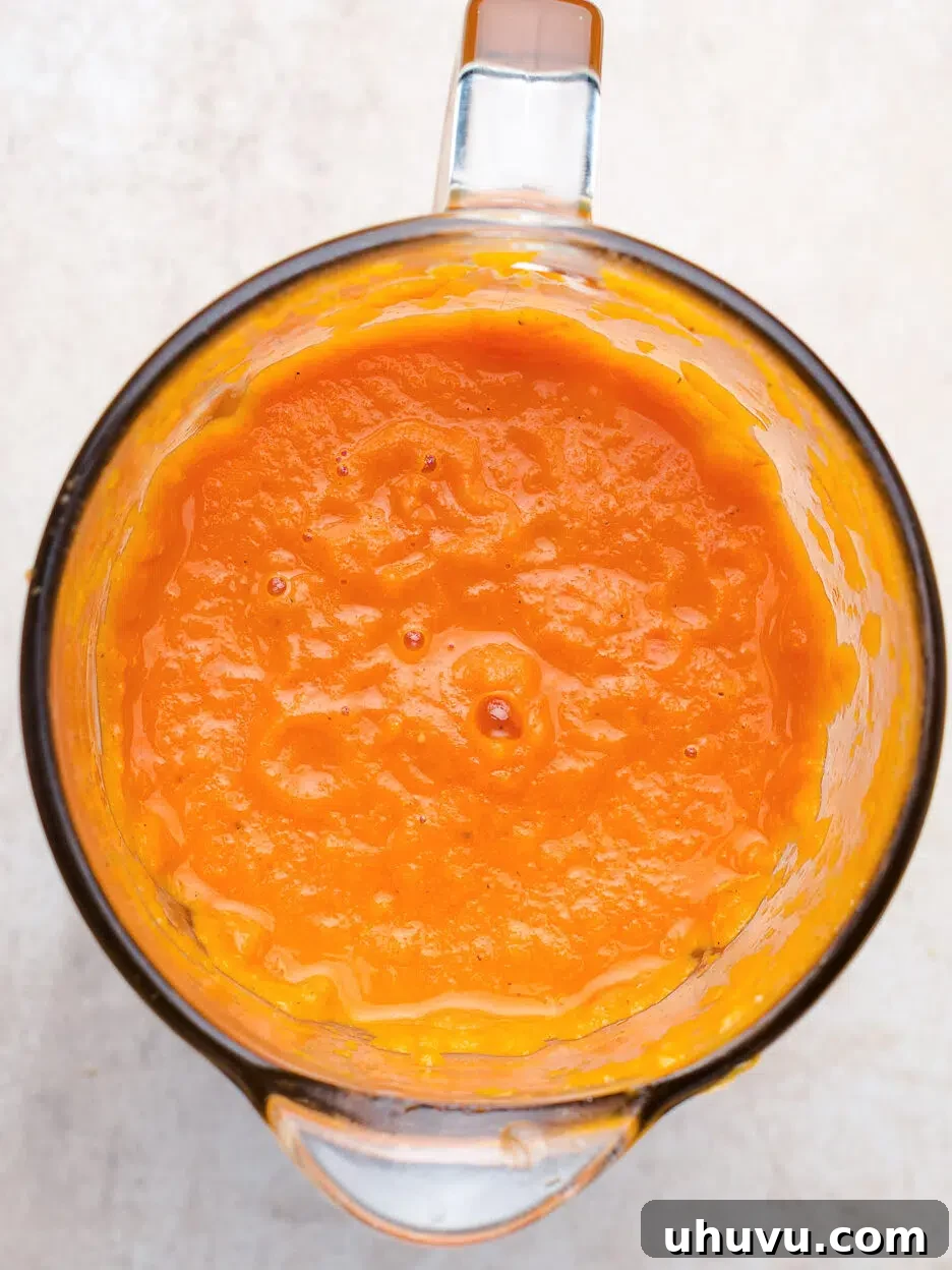 blending tomato soup for a smooth consistency